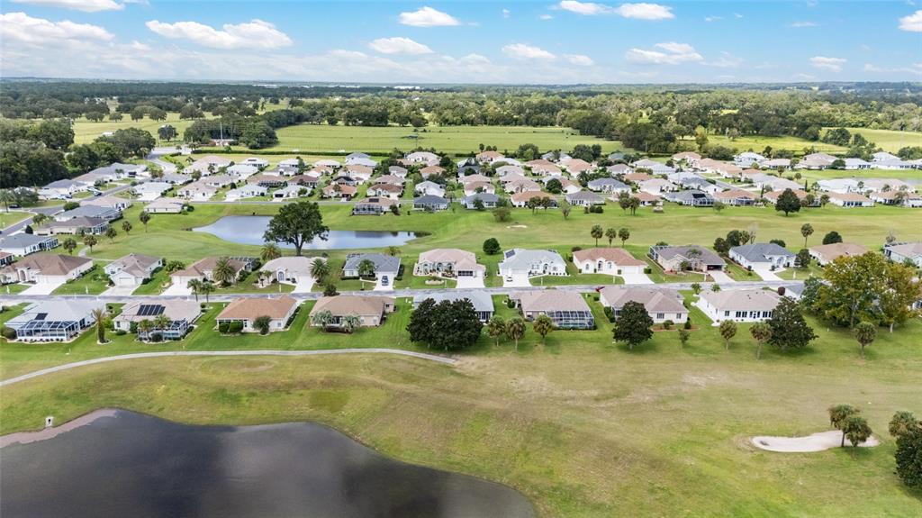 5719 Northwest 25th Loop Ocala, FL 34482 - Photo 59 of 67 a view of a city with lawn chairs