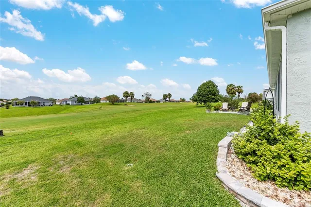 a view of a hallway with entryway and front door