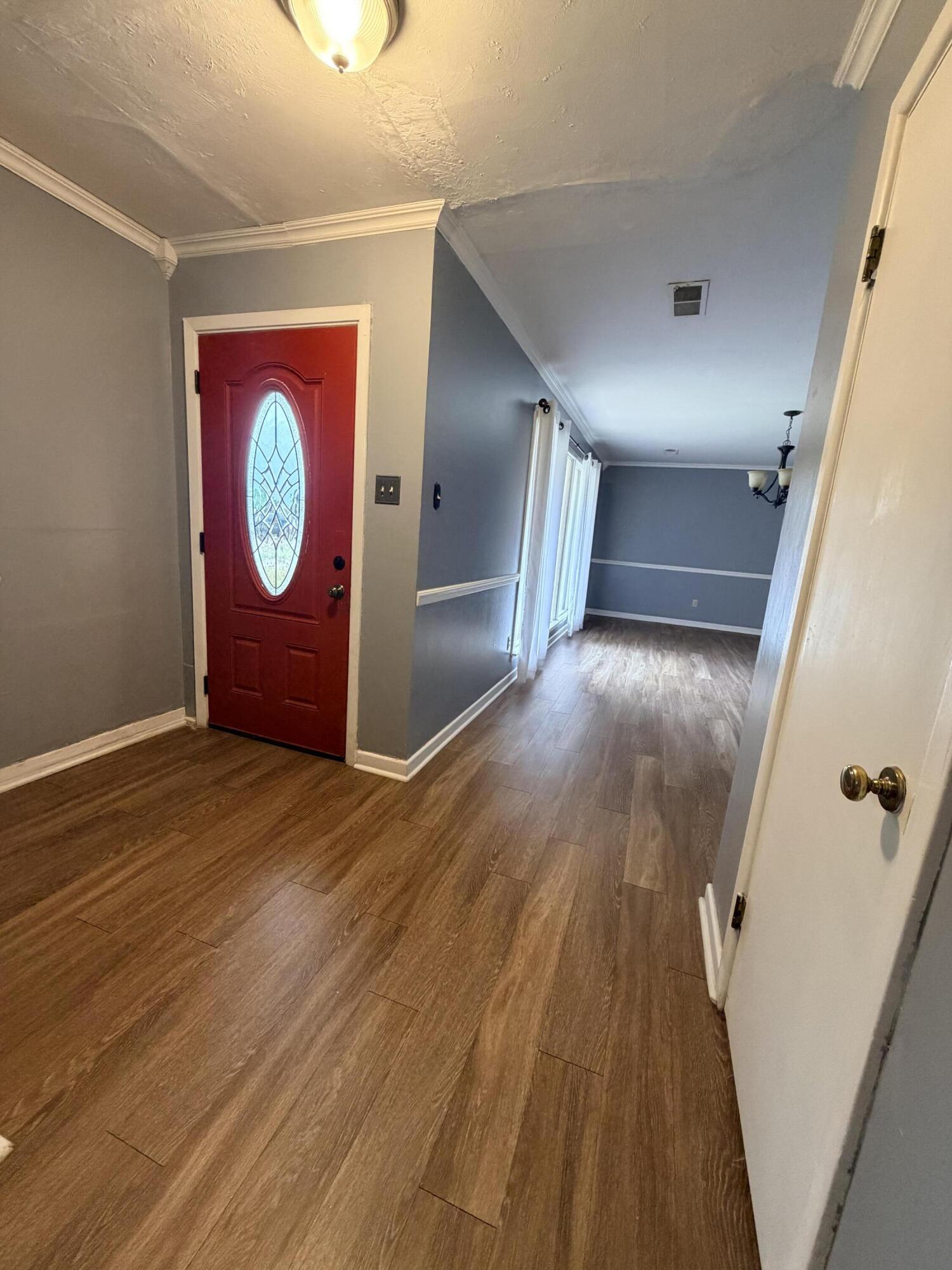 3814 27th Street Lubbock, TX 79410 - Photo 2 of 24 a view of a hallway with wooden floor