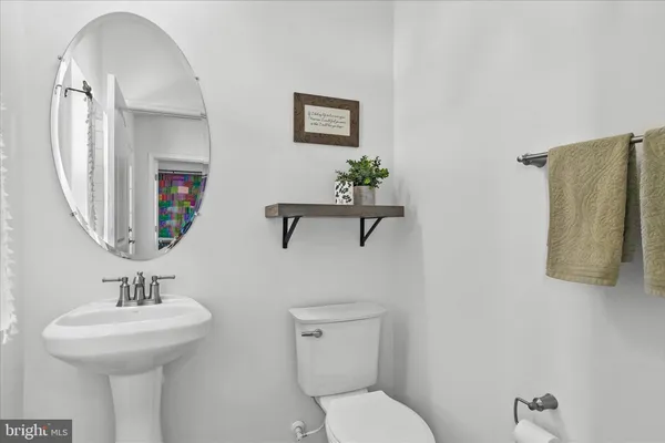 a bedroom with a bed and glass window