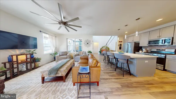 a large kitchen with a table and chairs in it