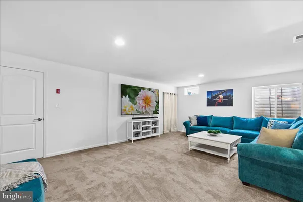 a view of a house with a yard and table and chairs