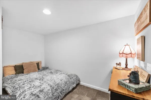 a living room with furniture flat screen tv and wooden floor