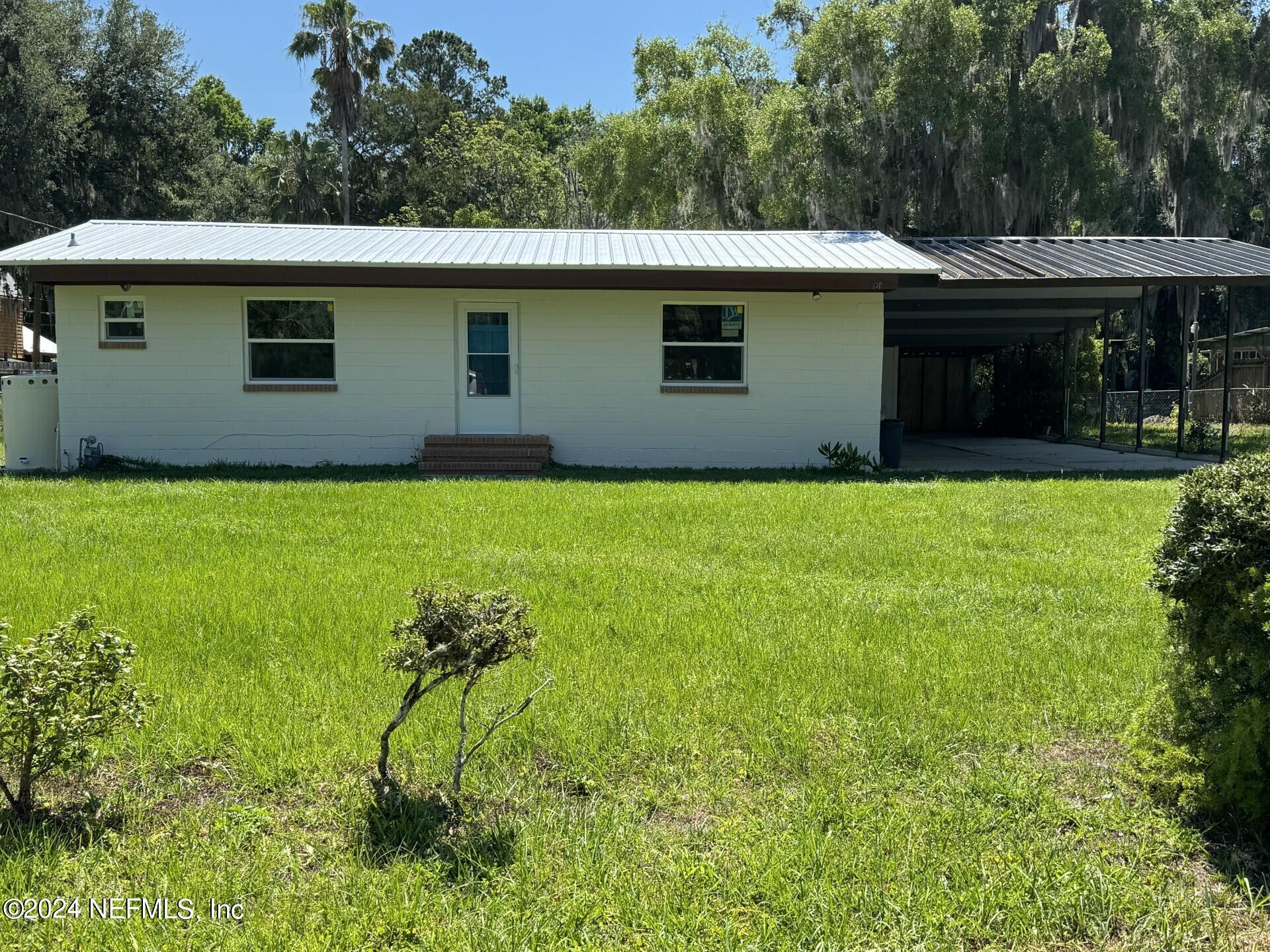 130 Boca Raton Road Satsuma, FL 32189 - Photo 15 of 20 a house view with a garden space