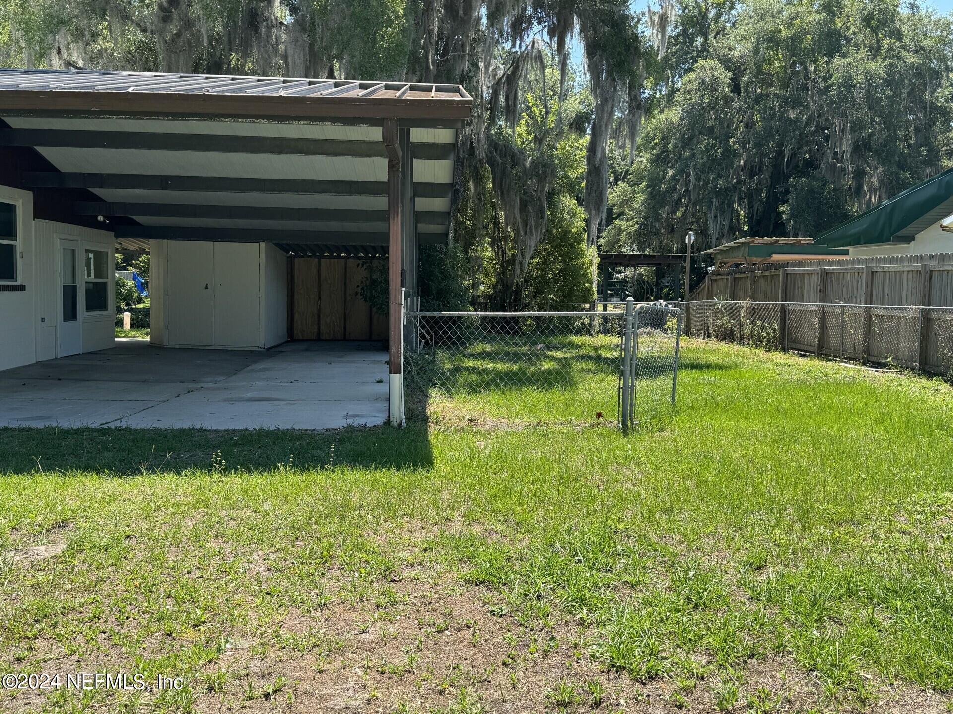 130 Boca Raton Road Satsuma, FL 32189 - Photo 16 of 20 a view of backyard with swimming pool and seating