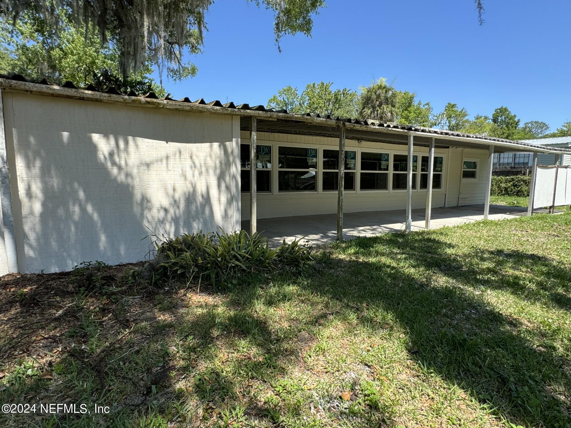 130 Boca Raton Road Satsuma, FL 32189 - Photo 18 of 20 a view of a house with a yard