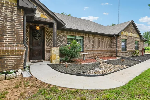 a view of a house with a porch and couches