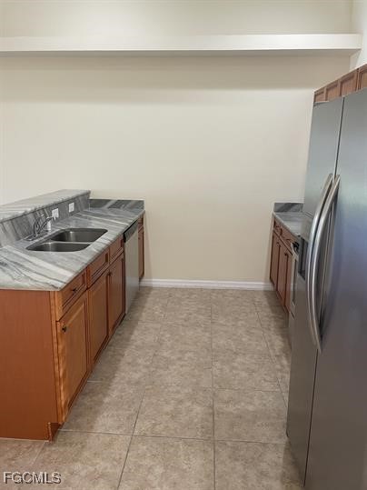 3818 Southwest 16th Place, Unit 3818 Cape Coral, FL 33914 - Photo 5 of 10 a kitchen with a stove and a refrigerator