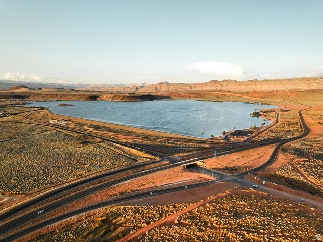 1693 Devils Gdn Lane Washington, UT 84780 - Photo 63 of 64 Expansive lakefront property featuring a broad body of water, surrounding desert landscape, and winding roadways