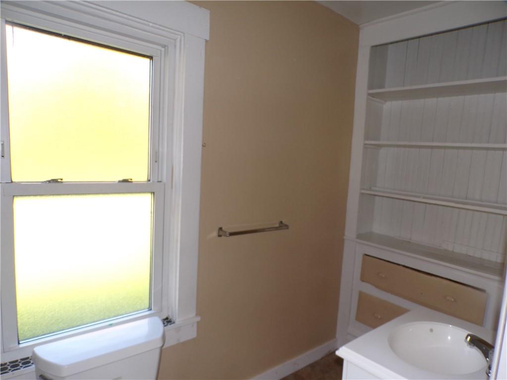 575 Grant Street Indiana, PA 15701 - Photo 12 of 19 a bathroom with a toilet a sink and a window