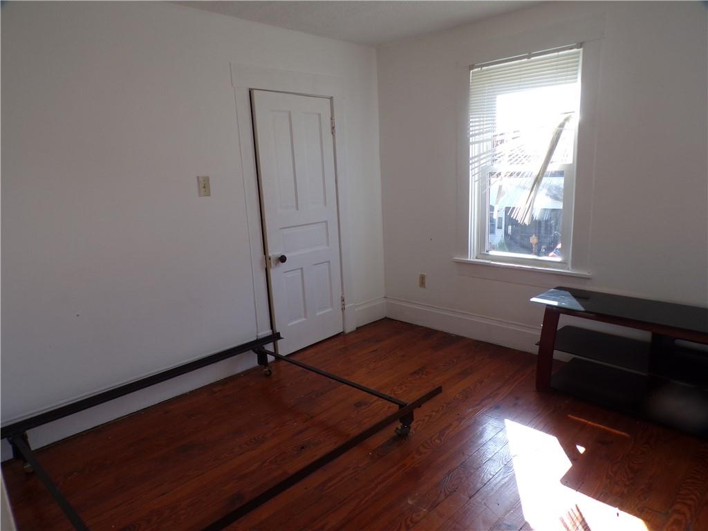 575 Grant Street Indiana, PA 15701 - Photo 14 of 19 an empty room with wooden floor and windows