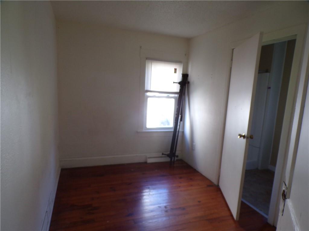 575 Grant Street Indiana, PA 15701 - Photo 10 of 19 an empty room with wooden floor and windows