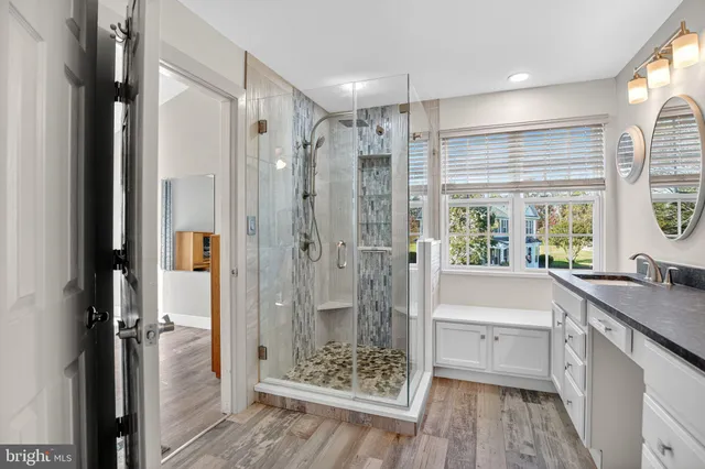 a bathroom with a tub shower and sink