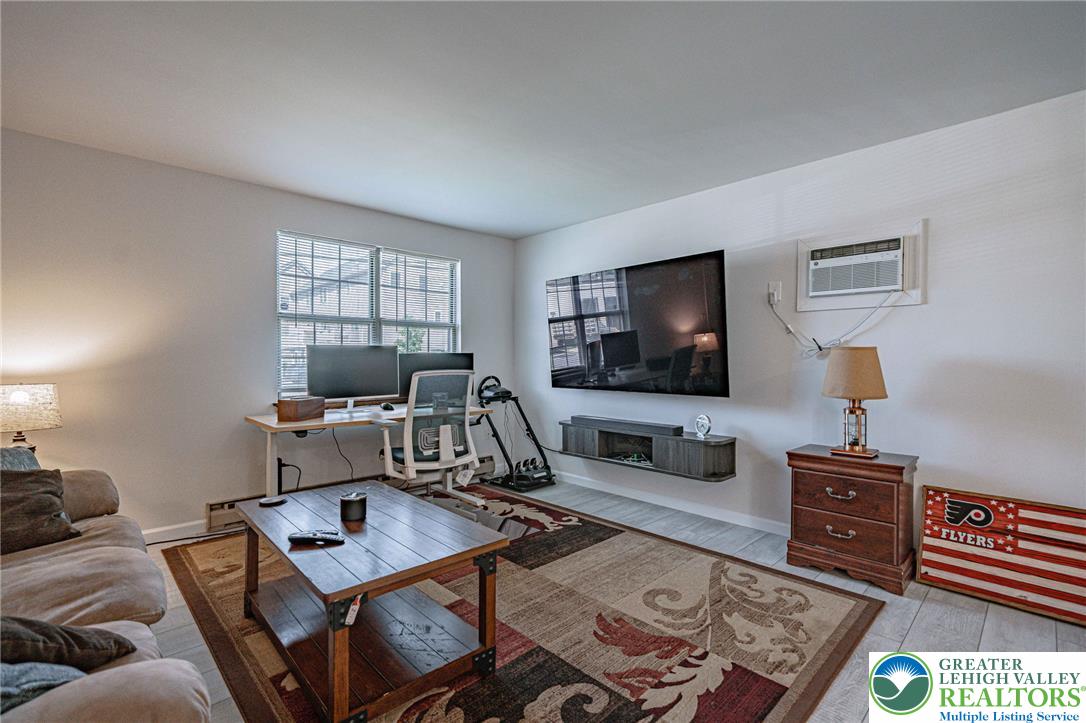 25 North 8th Street Emmaus, PA 18049 - Photo 5 of 51 A well-lit living area offers an adaptable space for both relaxation and productivity.