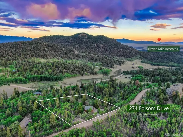 a view of a pathway with a yard and mountain view
