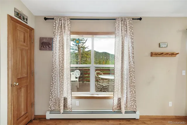 a view of a bathroom with a glass door