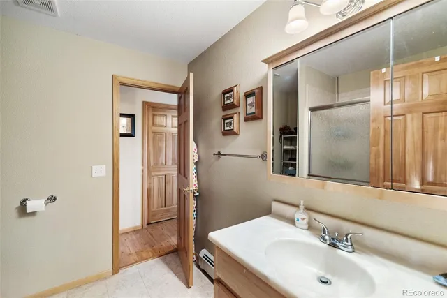 a bedroom with two beds and windows