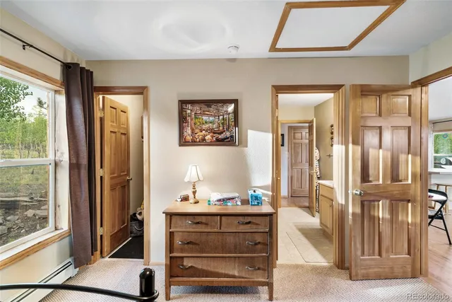 a view of a big house with a big yard and large trees