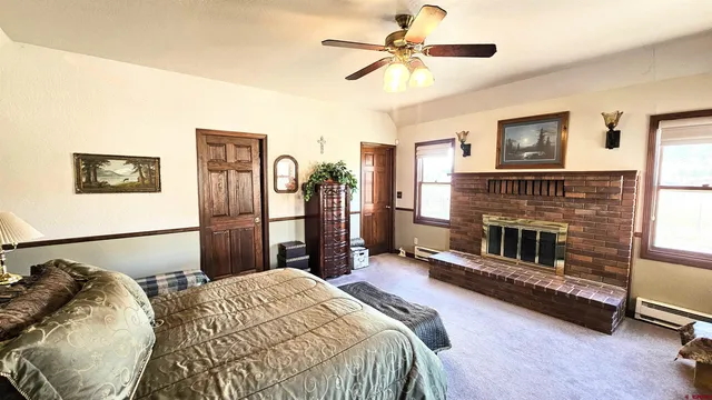 a bed room with a bed and a fireplace