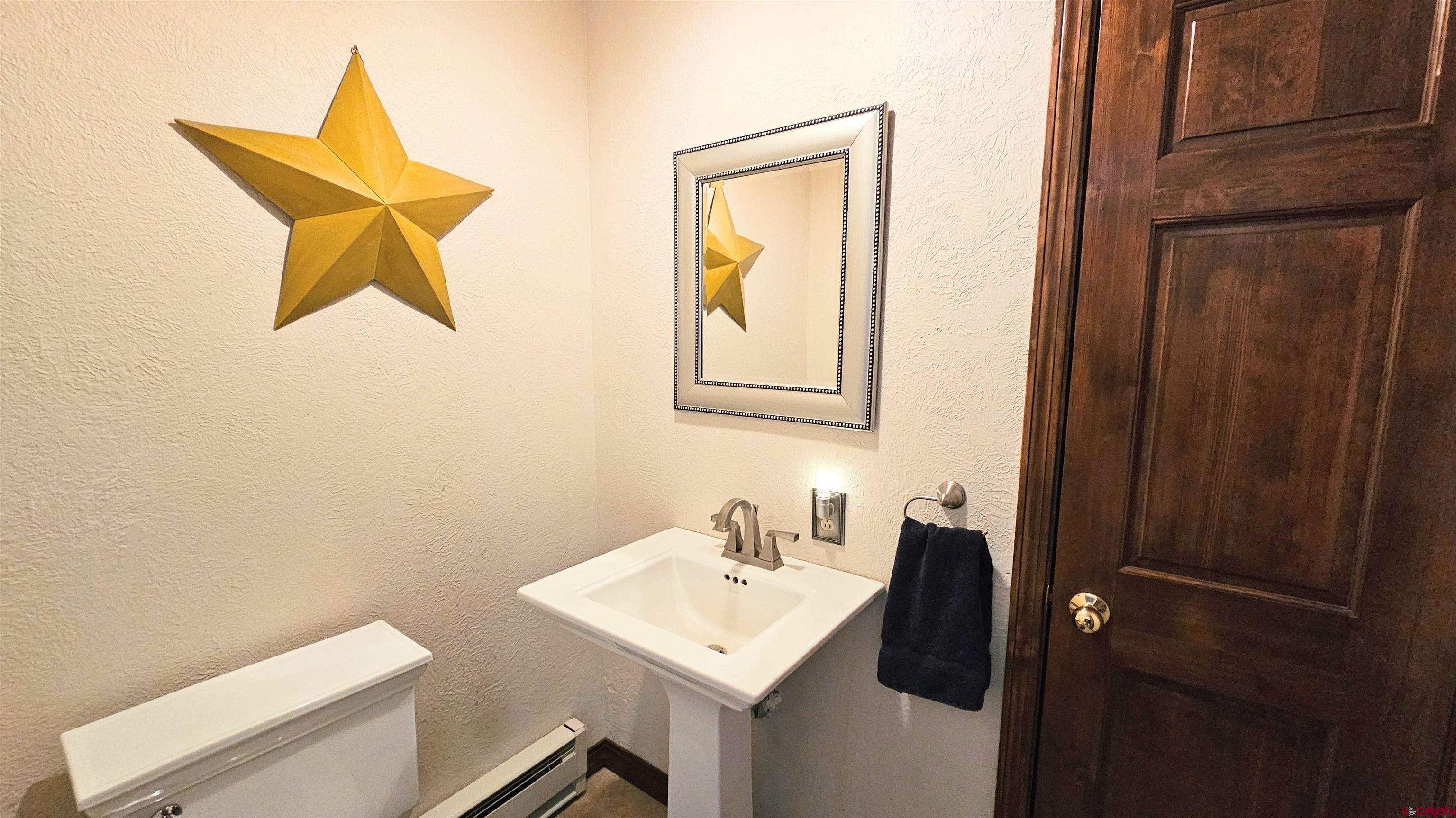 Undisclosed Beaver Creek Road South Fork, CO 81154 - Photo 15 of 26 a bathroom with a sink mirror and vanity