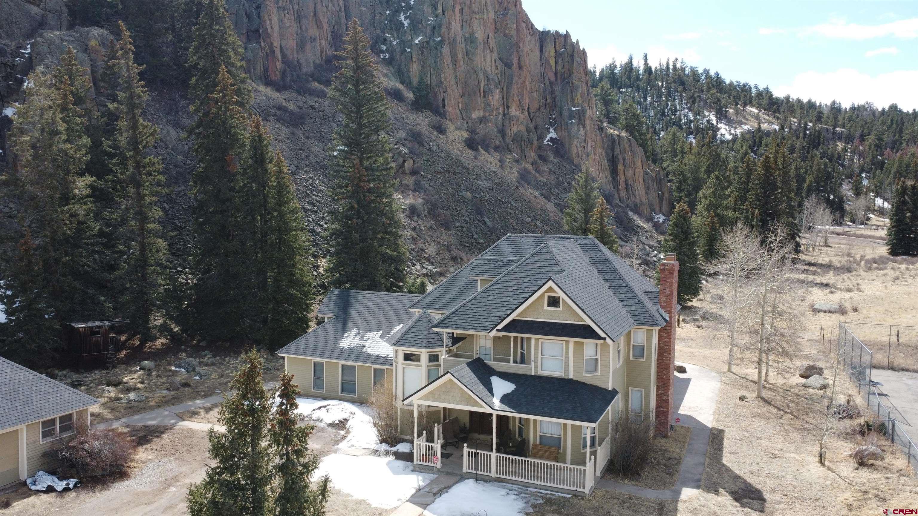 202 County Road 20 South Fork, CO 81154 - Photo 14 of 26 a front view of a house with a yard