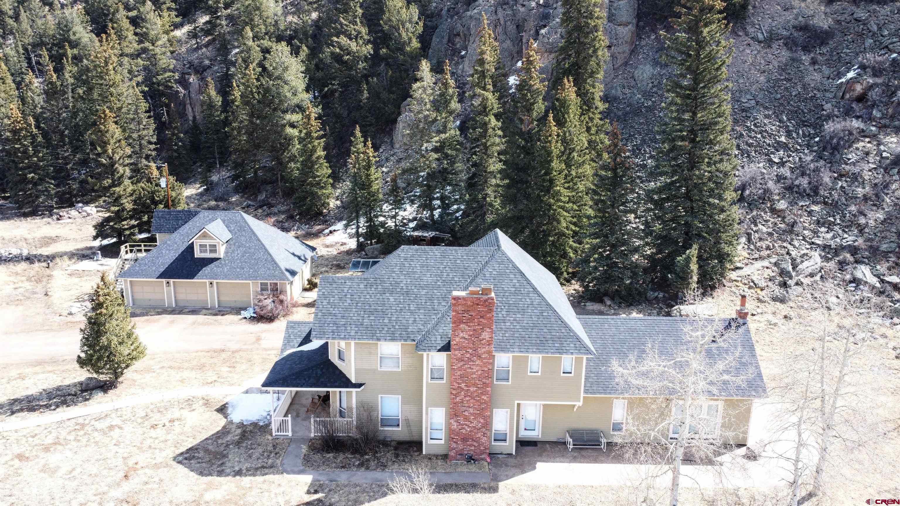202 County Road 20 South Fork, CO 81154 - Photo 15 of 26 a front view of a house with a yard