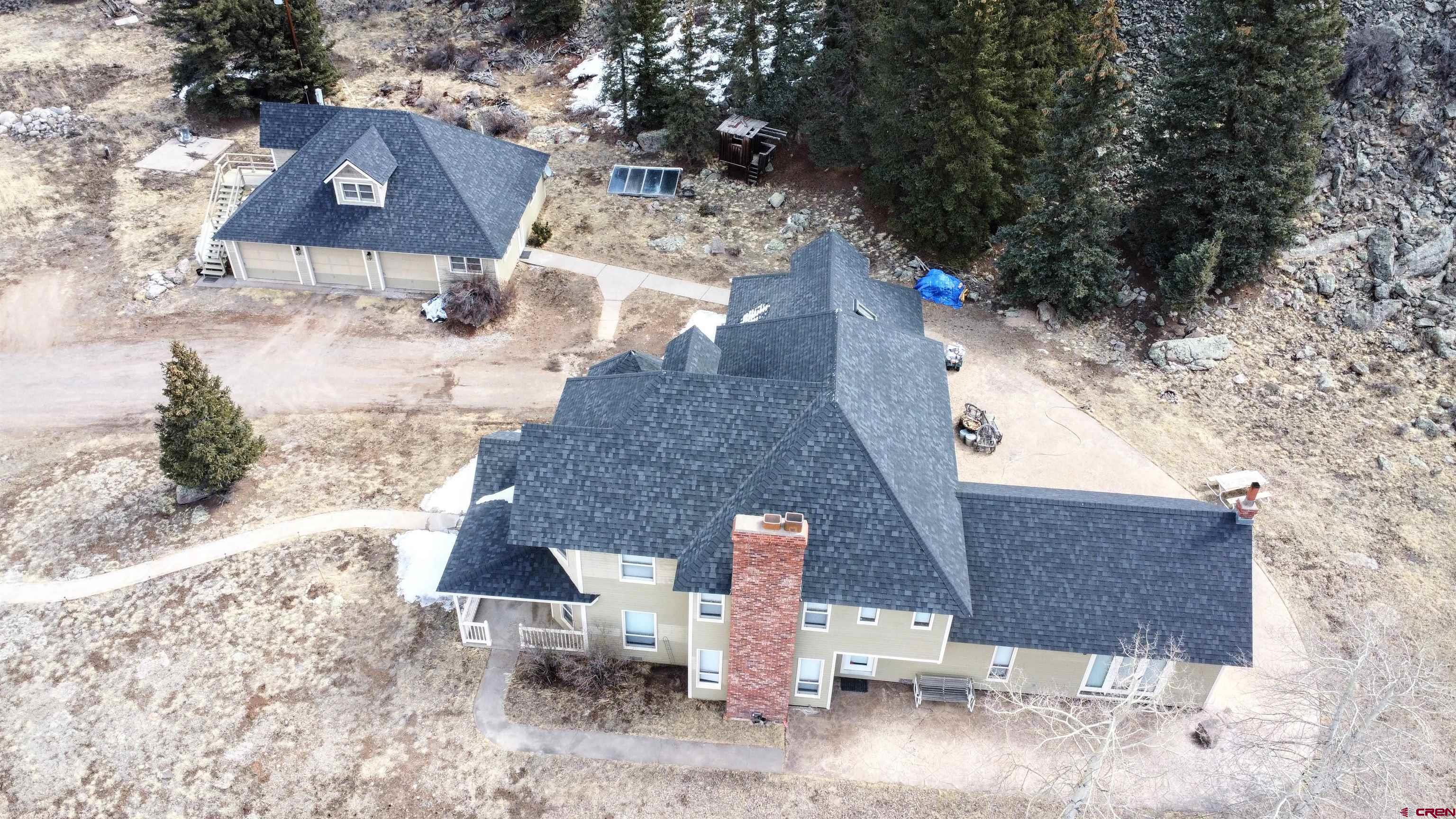 202 County Road 20 South Fork, CO 81154 - Photo 19 of 26 an aerial view of a house with a yard and large trees