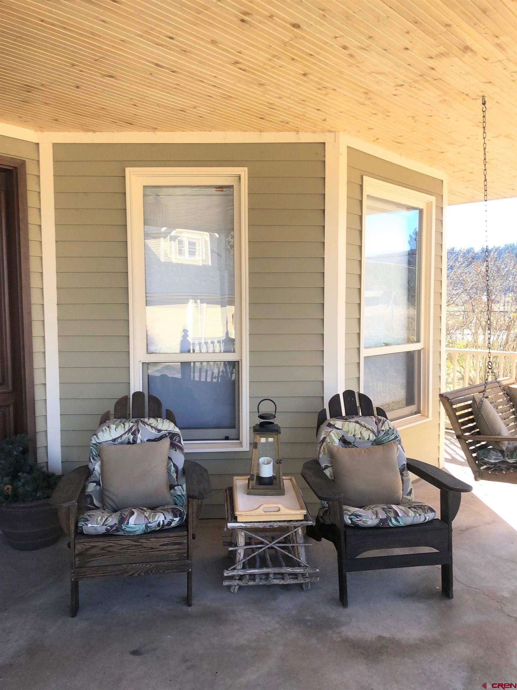 Undisclosed Beaver Creek Road South Fork, CO 81154 - Photo 23 of 26 a living room with furniture and a floor to ceiling window