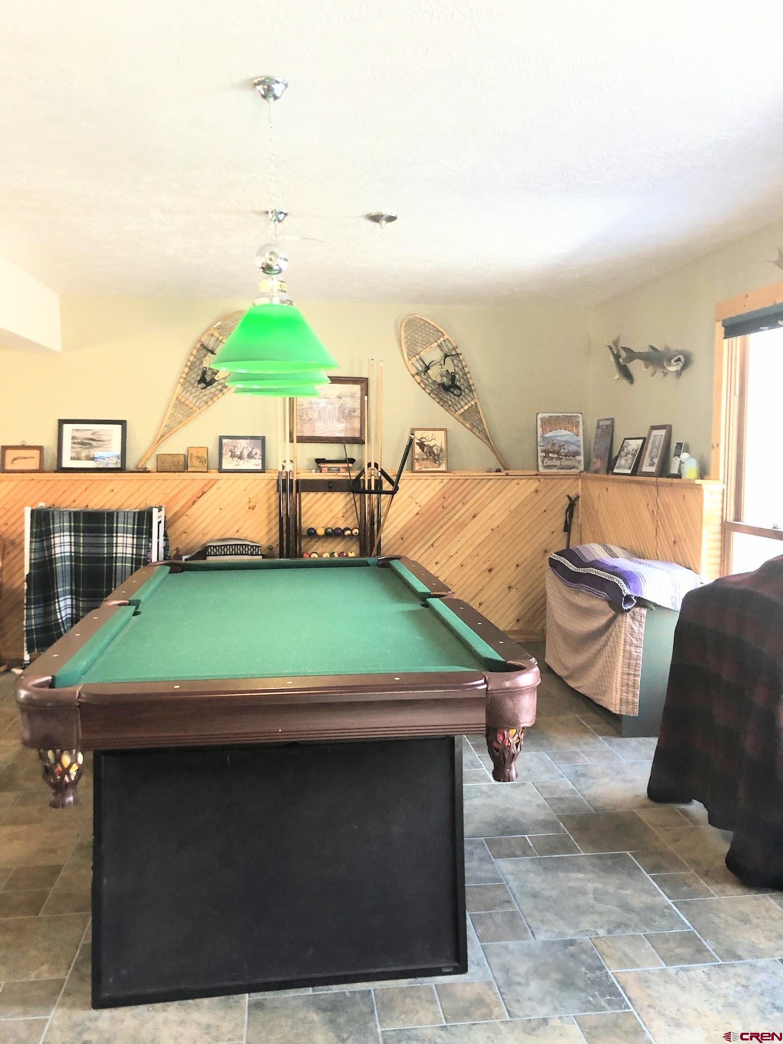 Undisclosed Beaver Creek Road South Fork, CO 81154 - Photo 24 of 26 a living room with furniture and a flat screen tv