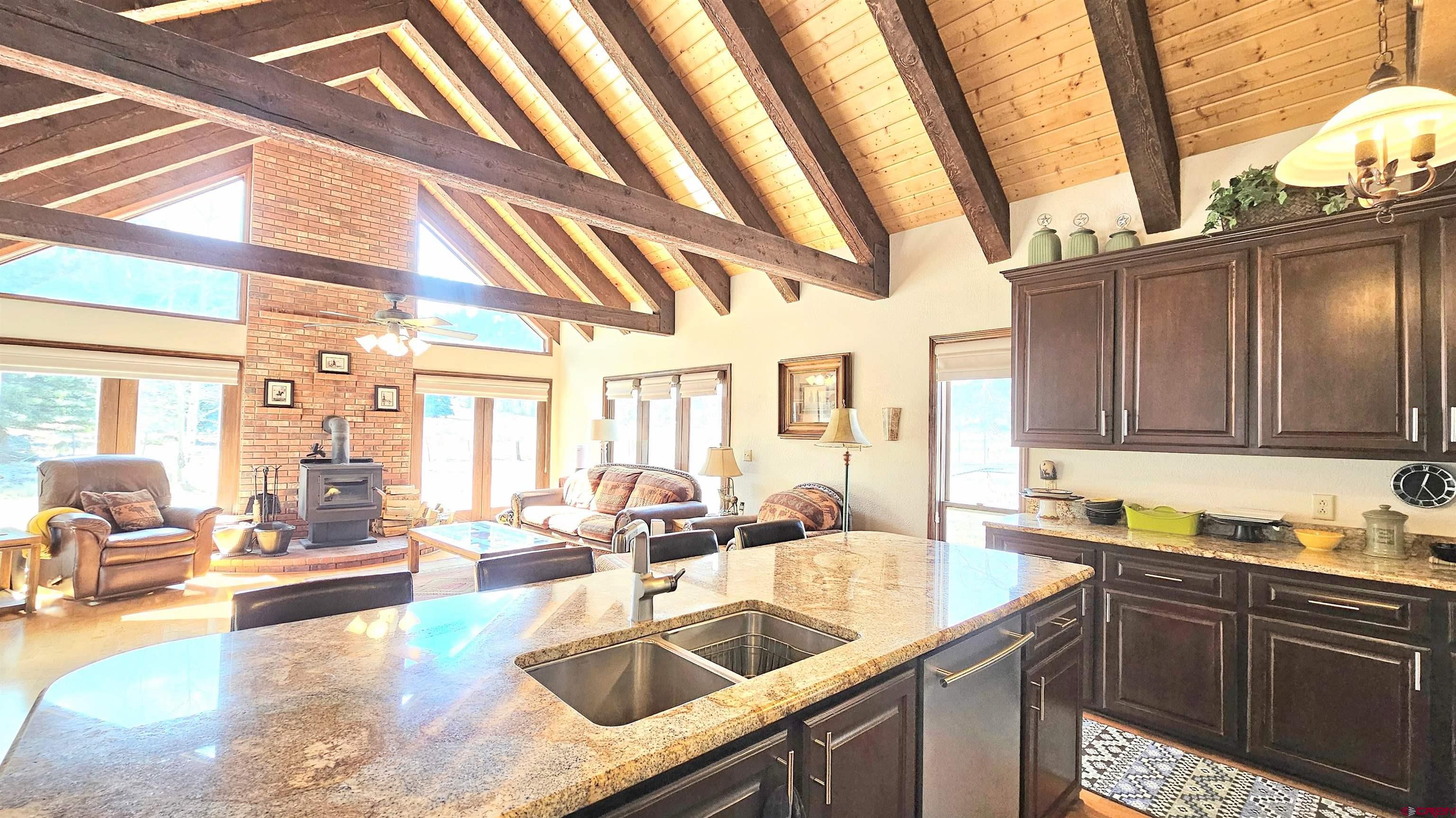 202 County Road 20 South Fork, CO 81154 - Photo 25 of 26 a kitchen with granite countertop a sink and a counter top space