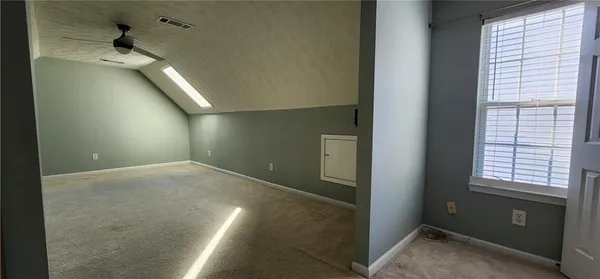 a view of a hallway with windows