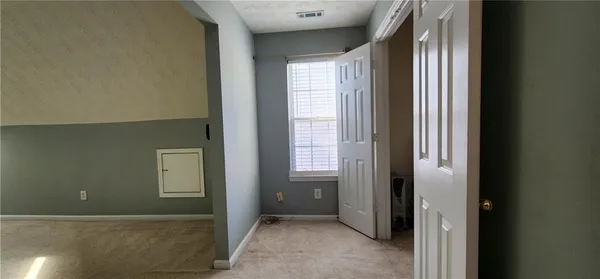 a bathroom with a granite countertop shower and a toilet