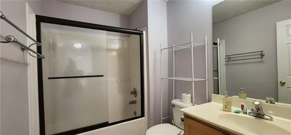 a kitchen with stainless steel appliances granite countertop a refrigerator a stove and a sink