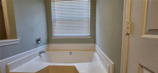 a kitchen with cabinets appliances and a sink