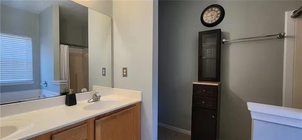 a kitchen with a sink stainless steel appliances and cabinets