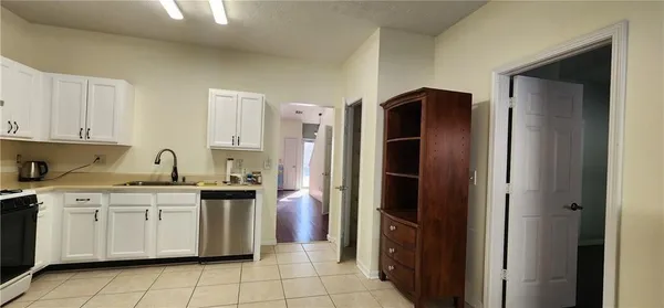 a kitchen with a stove and a microwave