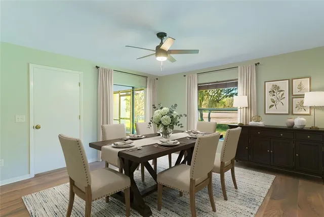 a view of a dining room with furniture window and wooden floor