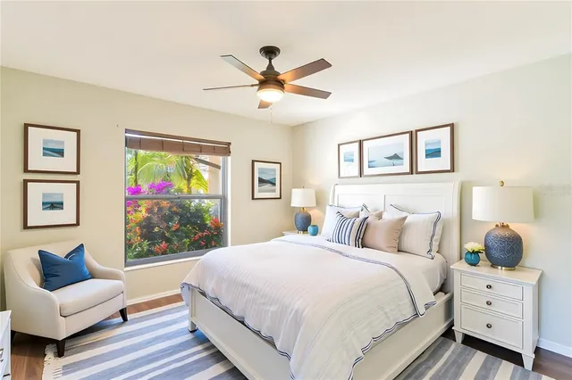 a bedroom with a large bed and a window