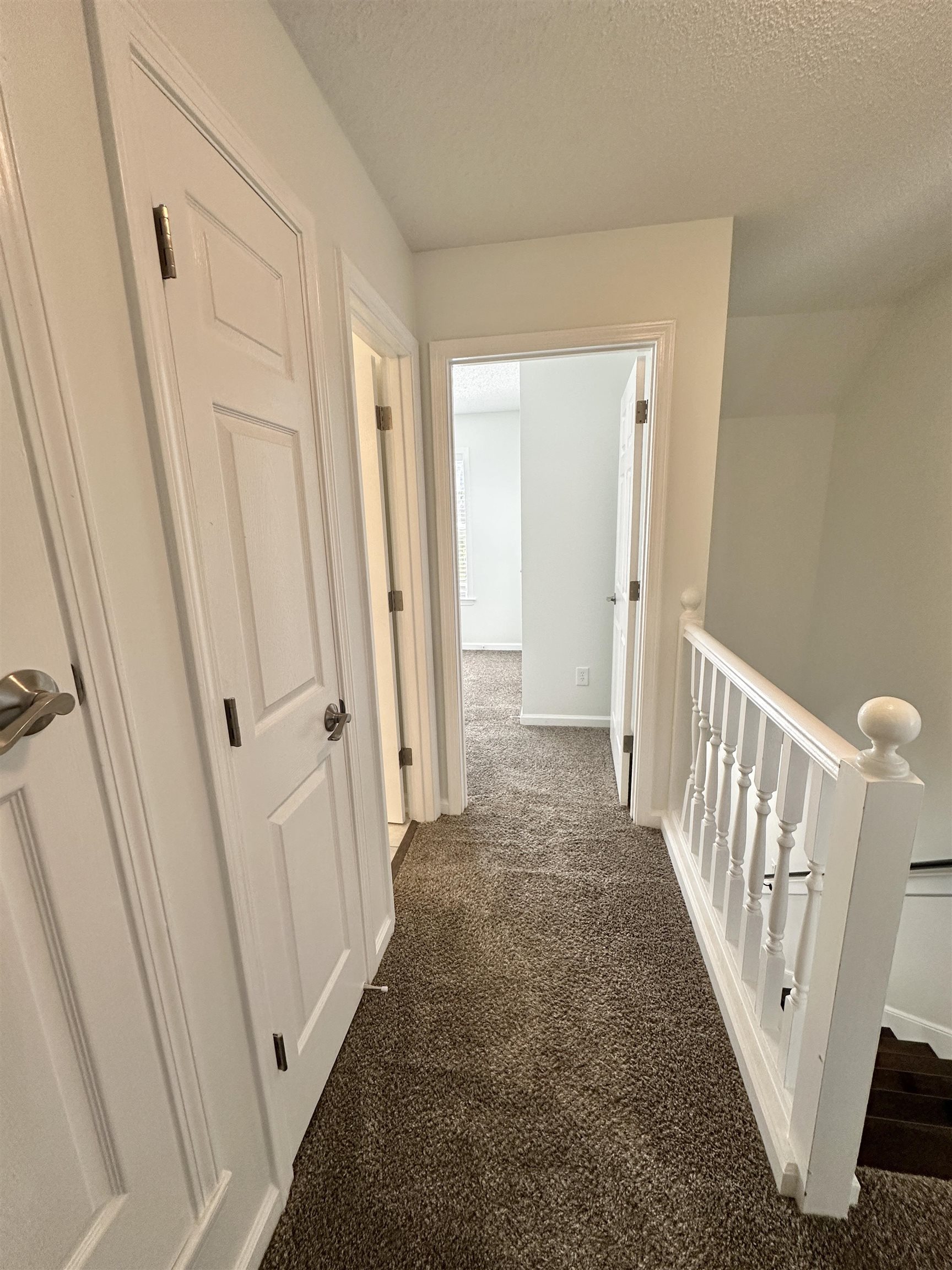 10006 Cameron Ridge Trail Memphis, TN 38016 - Photo 9 of 29 a view of a hallway with wooden floor and entryway