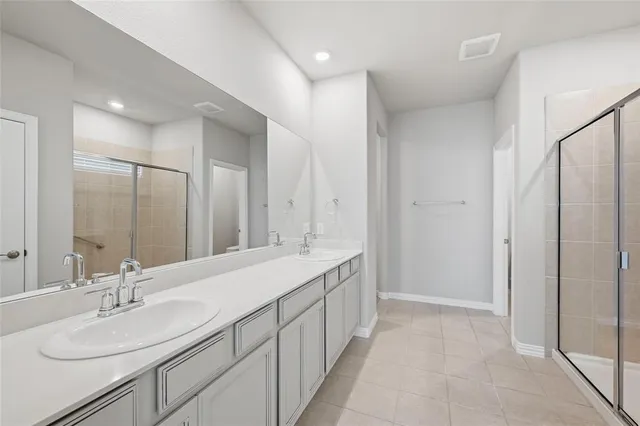 a bathroom with a double vanity sink mirror and double
