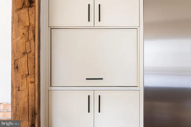 a kitchen with granite countertop a stove and a sink