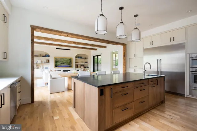 a open kitchen with stainless steel appliances granite countertop a sink and cabinets