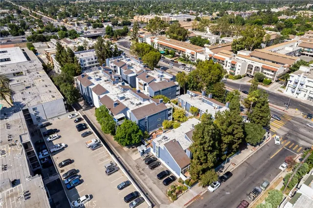 an aerial view of residential houses with outdoor space