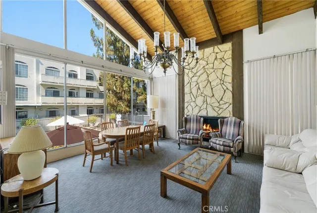 a room with pool table and windows
