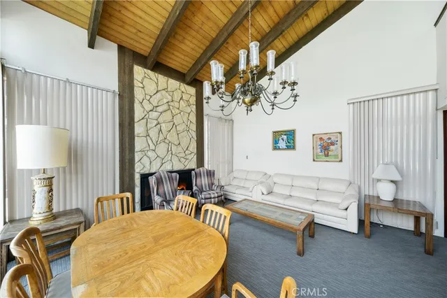a roof deck view with chairs and a table