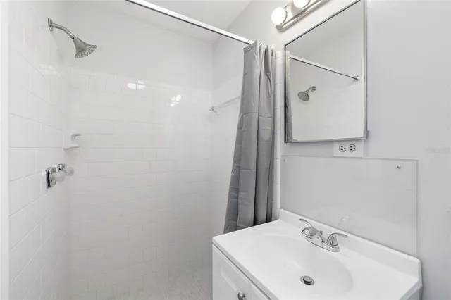 a bathroom with a sink and mirror