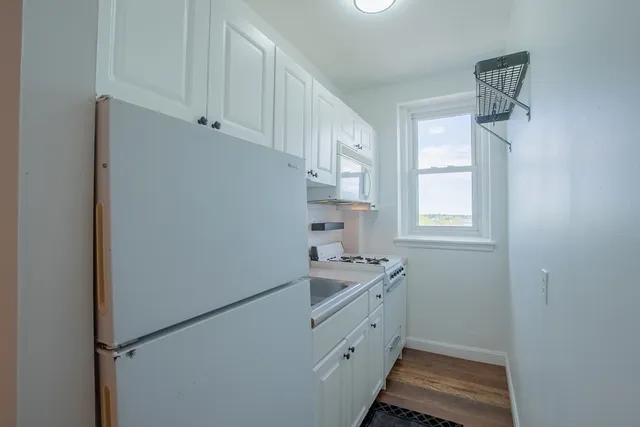 a room with cabinets and a window