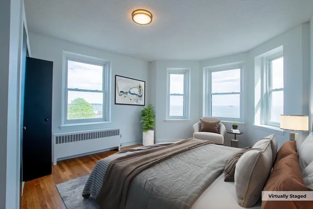 a bedroom with two beds and a window