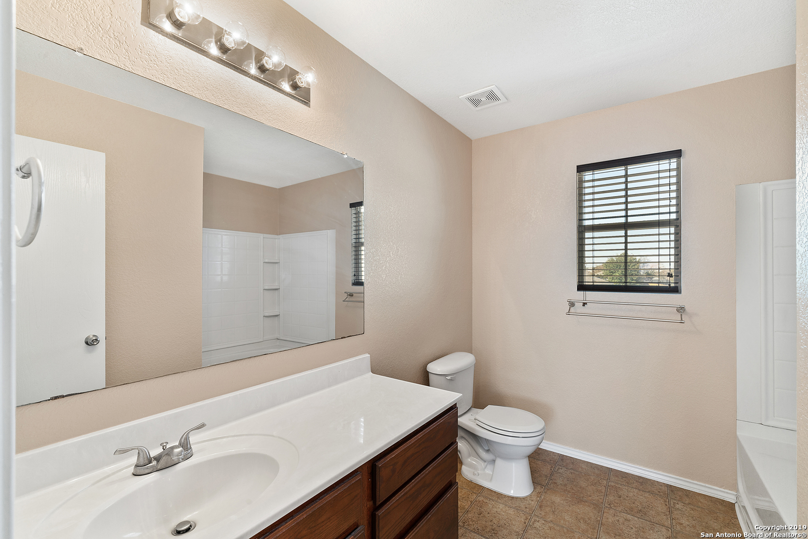 264 Cactus Patch Schertz, TX 78154 - Photo 14 of 25 a bathroom with a sink a toilet and mirror