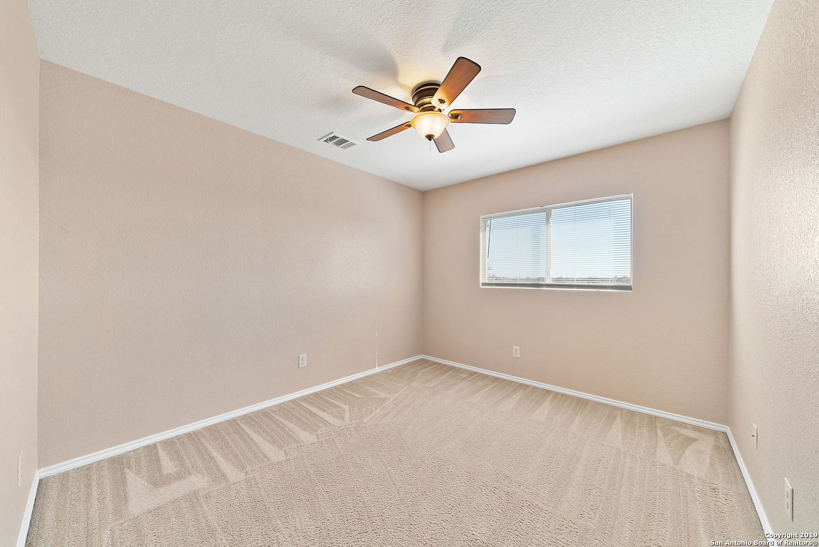 264 Cactus Patch Schertz, TX 78154 - Photo 19 of 25 a view of a big room with wooden floor and windows